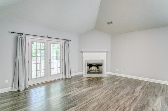 2331 Morgan Dr, Auburn, AL 36830 - unfurnished living room featuring french doors, wood finished floors, vaulted ceiling, and a premium fireplace