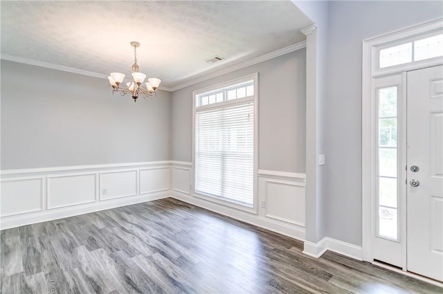 2331 Morgan Dr, Auburn, AL 36830 - foyer with a chandelier, ornamental molding, wainscoting, plenty of natural light, and wood finished floors