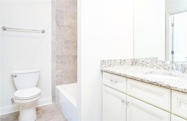 bathroom with tile patterned floors, vanity, and toilet