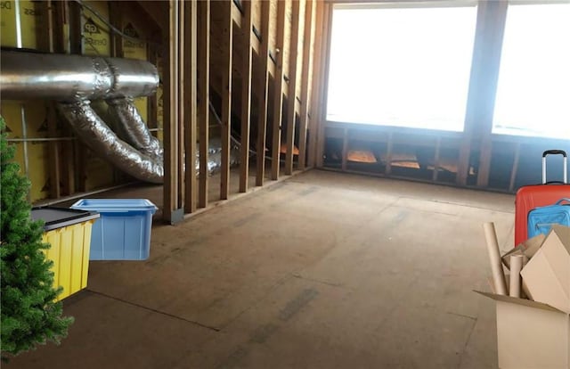 unfinished attic featuring a wealth of natural light