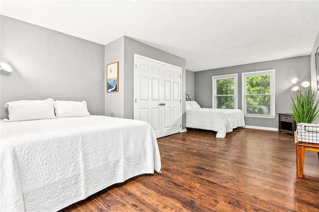 427 Harper Ave Unit 16, Auburn, AL 36830 - bedroom featuring dark wood-type flooring and baseboards