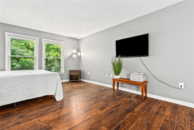 427 Harper Ave Unit 16, Auburn, AL 36830 - bedroom featuring wood finished floors and a textured ceiling