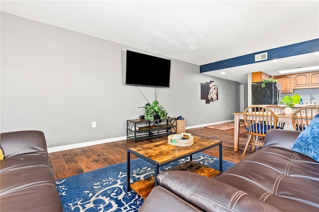 427 Harper Ave Unit 16, Auburn, AL 36830 - living area with baseboards and wood finished floors