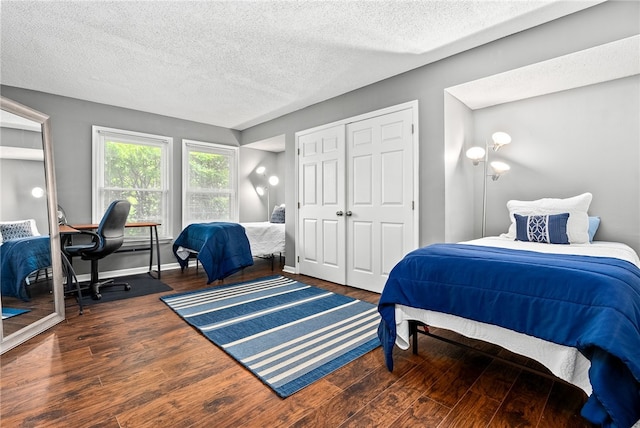427 Harper Ave Unit 16, Auburn, AL 36830 - bedroom with a textured ceiling, wood finished floors, and a closet