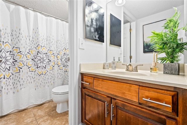 427 Harper Ave Unit 16, Auburn, AL 36830 - full bath featuring a textured ceiling, vanity, tile patterned flooring, and a shower with curtain