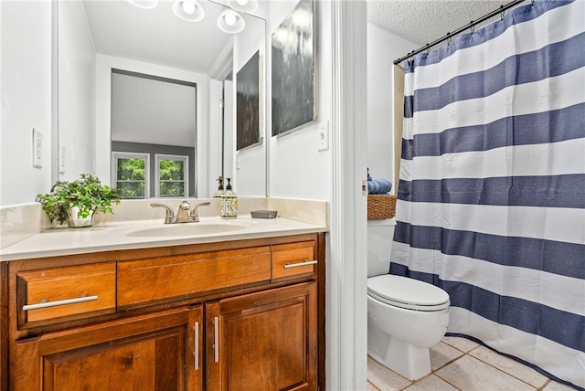 427 Harper Ave Unit 16, Auburn, AL 36830 - full bathroom featuring a textured ceiling, vanity, tile patterned floors, and a shower with shower curtain