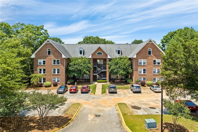 427 Harper Ave Unit 16, Auburn, AL 36830 - view of front of house featuring uncovered parking and brick siding