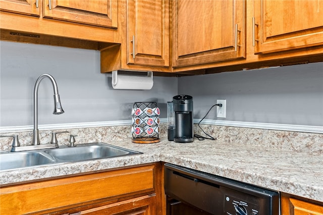427 Harper Ave Unit 16, Auburn, AL 36830 - kitchen featuring dishwasher, light countertops, and brown cabinetry