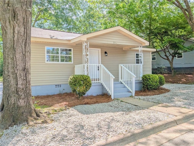 bungalow-style home with covered porch and crawl space