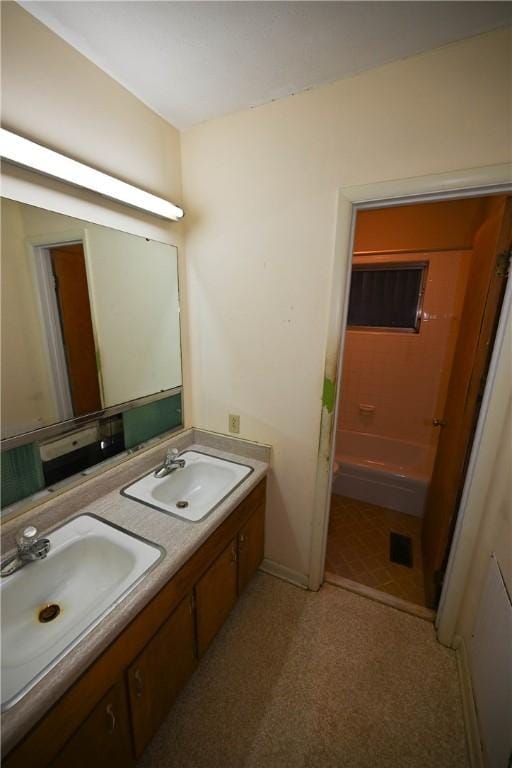 bathroom featuring shower / tub combination and sink