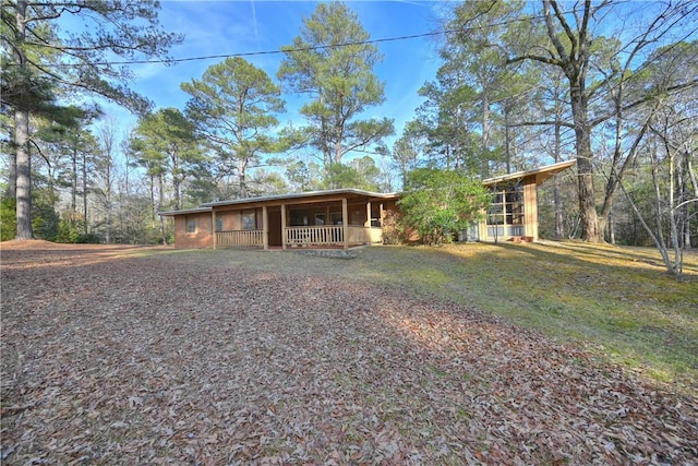 ranch-style home featuring covered porch