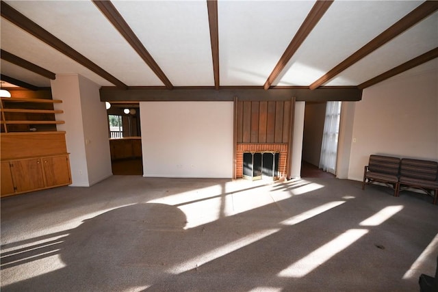 unfurnished living room with a brick fireplace, light colored carpet, and vaulted ceiling with beams