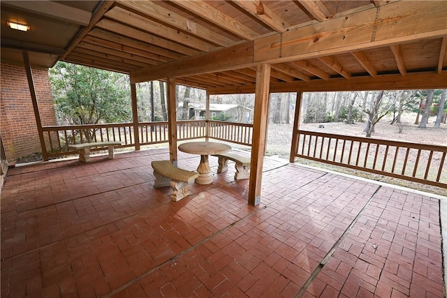 wooden deck with a patio