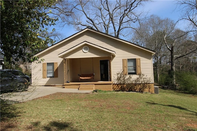 bungalow featuring a porch and a front lawn