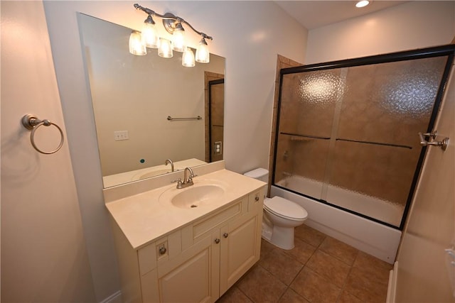 1758 Brookeview Ct, Auburn, AL 36830 - bathroom featuring toilet, vanity, tile patterned flooring, and combined bath / shower with glass door