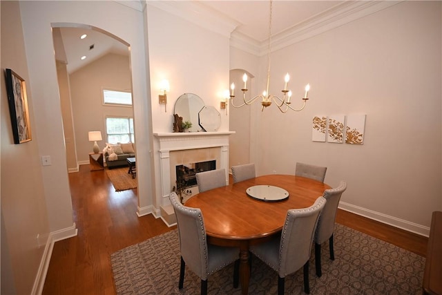 1758 Brookeview Ct, Auburn, AL 36830 - dining space with wood finished floors, arched walkways, a fireplace, a chandelier, and baseboards