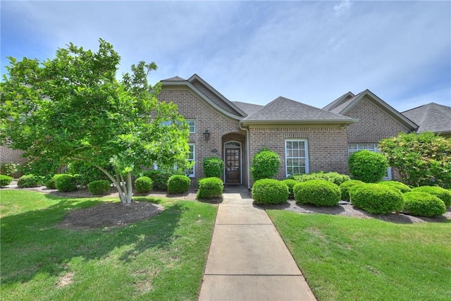 1758 Brookeview Ct, Auburn, AL 36830 - traditional-style house with brick siding, a front yard, and roof with shingles