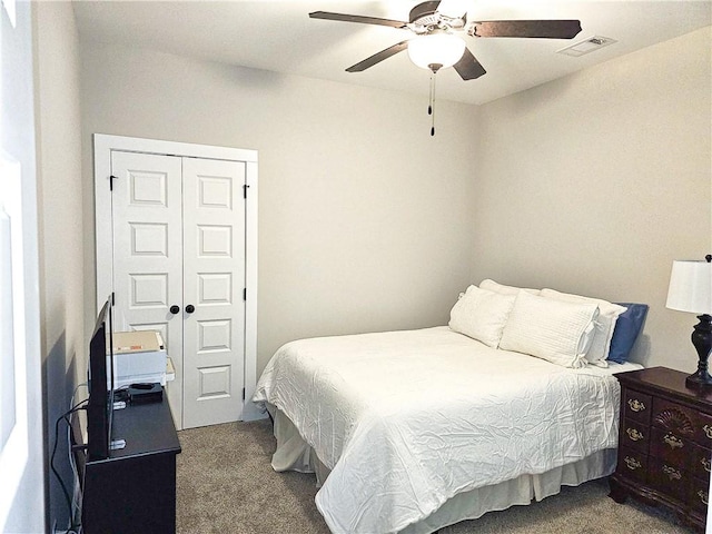 bedroom with carpet, a closet, and ceiling fan