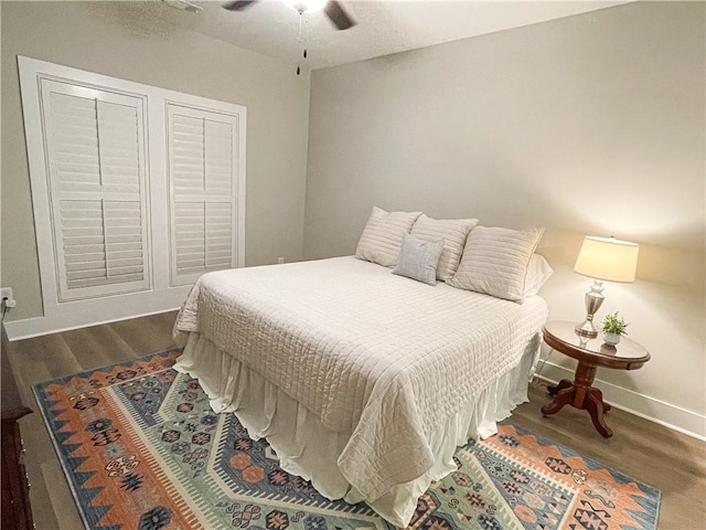 bedroom featuring ceiling fan and dark hardwood / wood-style flooring