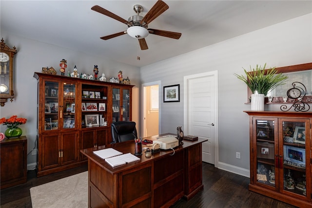 home office featuring ceiling fan and dark hardwood / wood-style floors