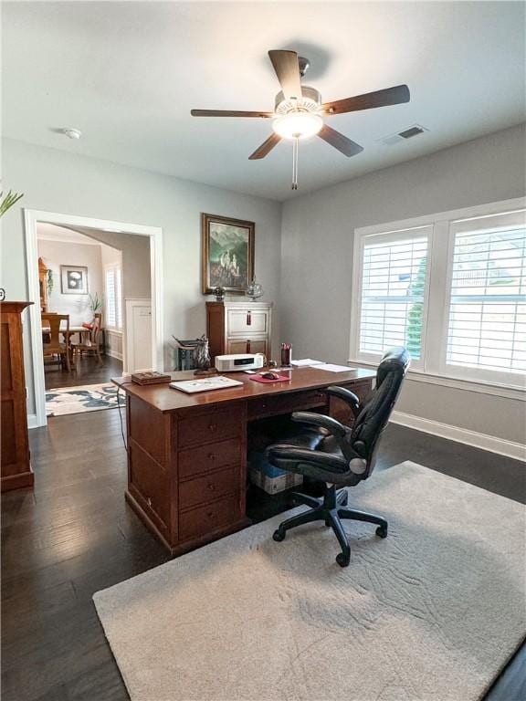 office area with ceiling fan and dark hardwood / wood-style floors