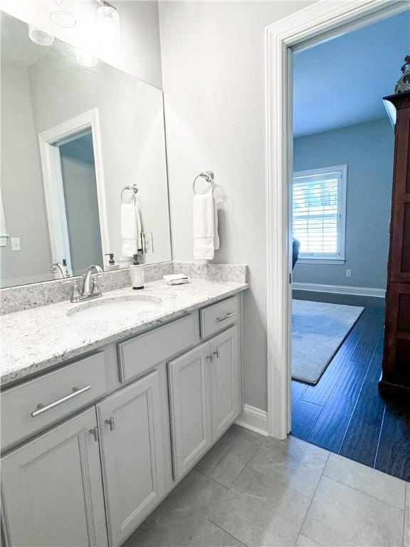 bathroom with tile patterned floors and vanity