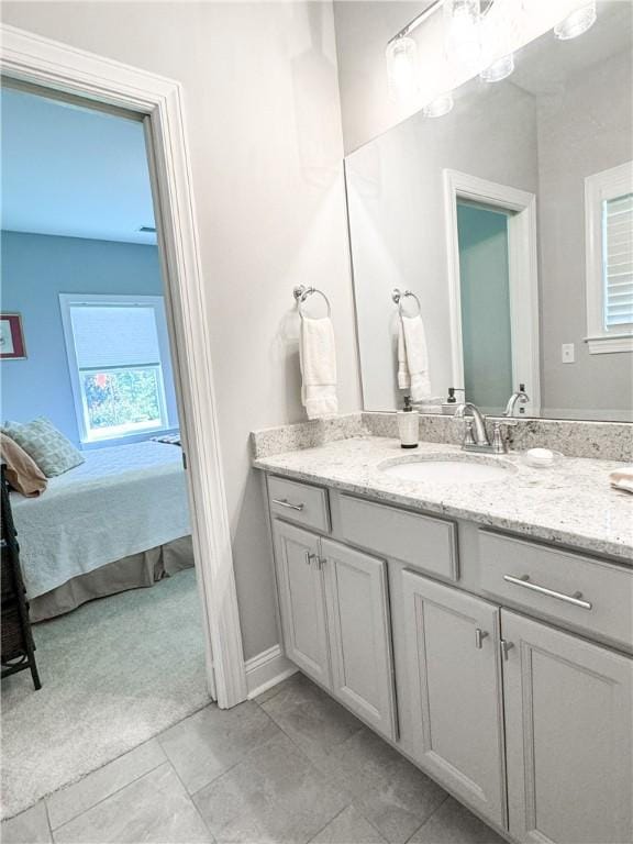 bathroom featuring tile patterned flooring and vanity