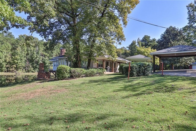 view of yard featuring a carport