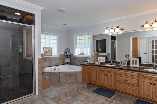 bathroom featuring vanity, crown molding, and independent shower and bath