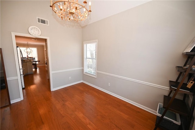 1798 Brookhaven Ct, Auburn, AL 36830 - empty room featuring a chandelier, baseboards, visible vents, and a wealth of natural light