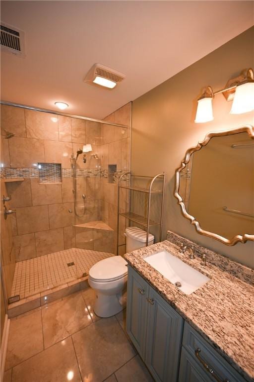 1798 Brookhaven Ct, Auburn, AL 36830 - full bath with a shower stall, vanity, tile patterned flooring, visible vents, and toilet