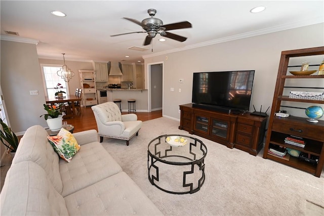 1798 Brookhaven Ct, Auburn, AL 36830 - living area featuring baseboards, recessed lighting, crown molding, visible vents, and ceiling fan with notable chandelier