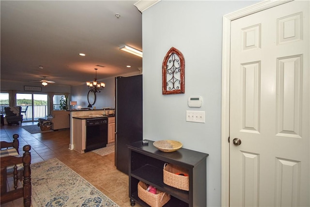 corridor with light tile patterned floors, crown molding, and a chandelier