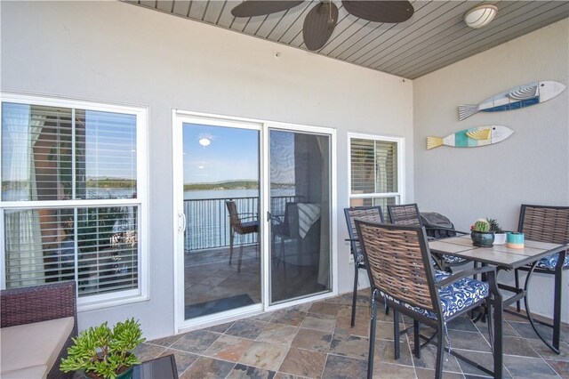 balcony featuring ceiling fan and a patio