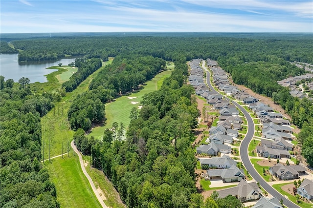 bird's eye view with a residential view, a water view, and a wooded view