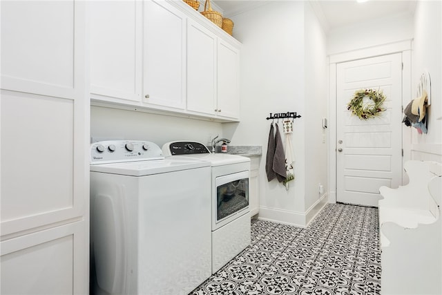 clothes washing area with baseboards, ornamental molding, light tile patterned floors, cabinet space, and independent washer and dryer