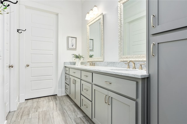 full bath with double vanity and a sink