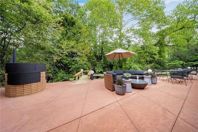 view of patio with an outdoor living space and outdoor dining space