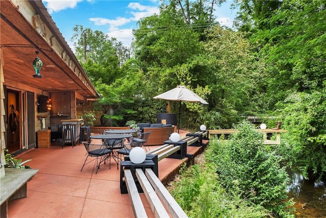 view of patio featuring outdoor dining area