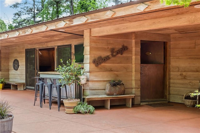 doorway to property featuring a patio