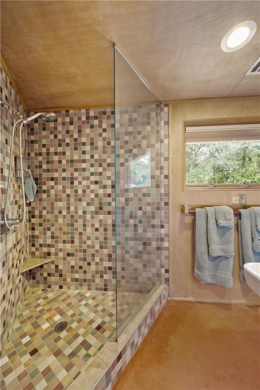 full bathroom featuring visible vents and a stall shower
