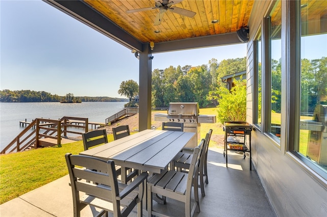 242 Williams Rd, Alexander City, AL 35010 - view of patio featuring a water view, ceiling fan, outdoor dining space, and an outdoor kitchen