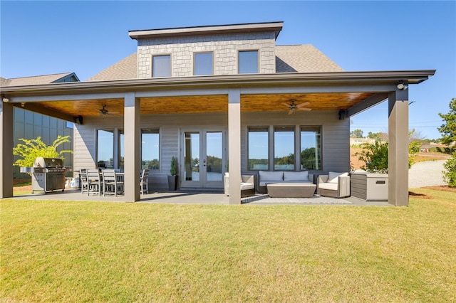 242 Williams Rd, Alexander City, AL 35010 - back of property featuring a ceiling fan, french doors, a lawn, and outdoor lounge area