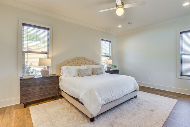 242 Williams Rd, Alexander City, AL 35010 - bedroom with multiple windows, crown molding, wood finished floors, recessed lighting, and ceiling fan