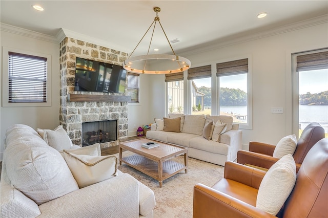 242 Williams Rd, Alexander City, AL 35010 - living area featuring a chandelier, healthy amount of natural light, crown molding, a stone fireplace, and recessed lighting