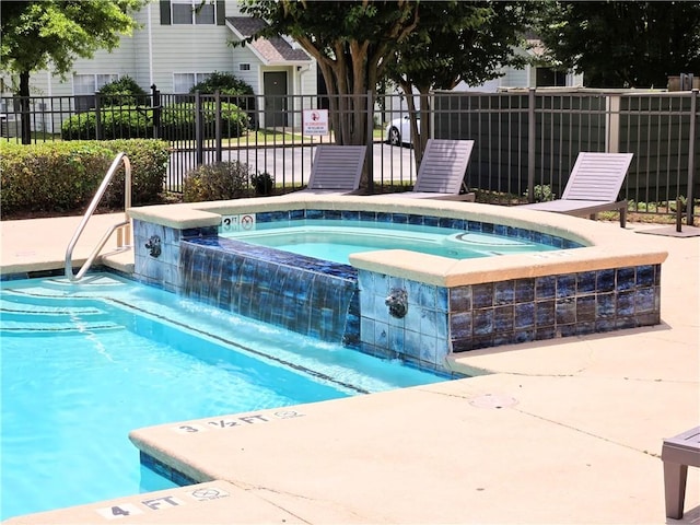 view of pool featuring a community hot tub