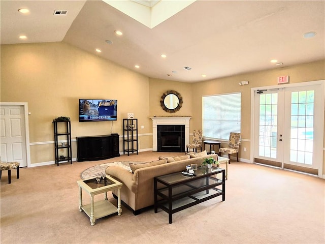 living room featuring a fireplace, light carpet, and vaulted ceiling