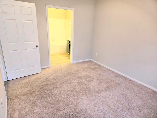 empty room with light colored carpet