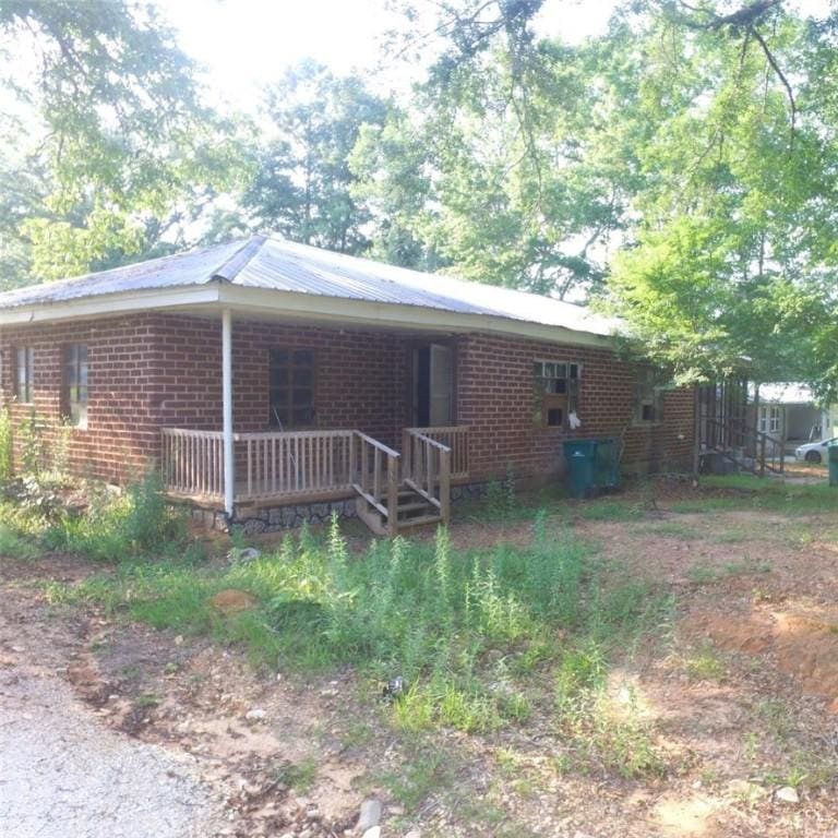 251 1st St NE, Lafayette, AL 36862 - view of side of home featuring brick siding