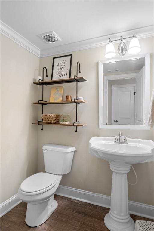 1195 Southridge Ct, Auburn, AL 36830 - bathroom with baseboards, wood finished floors, toilet, and ornamental molding